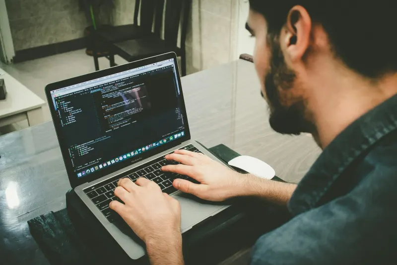 A go-to-market engineer reviewing a CRM data model and automation flow on a laptop screen