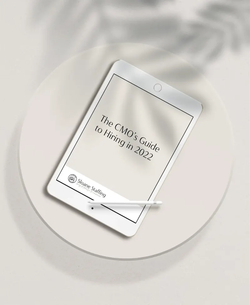 Tablet displaying “The CMO’s Guide to Hiring in 2022” by Sloane Staffing, with a stylus resting on the screen.