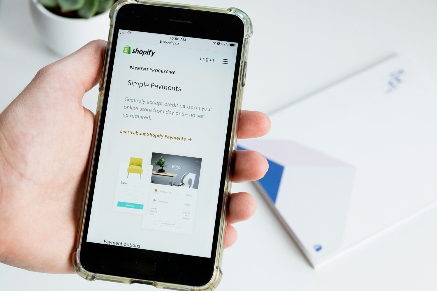 iPhone displaying the Shopify Simple Payments page, describing how to securely accept credit cards online with no setup required.