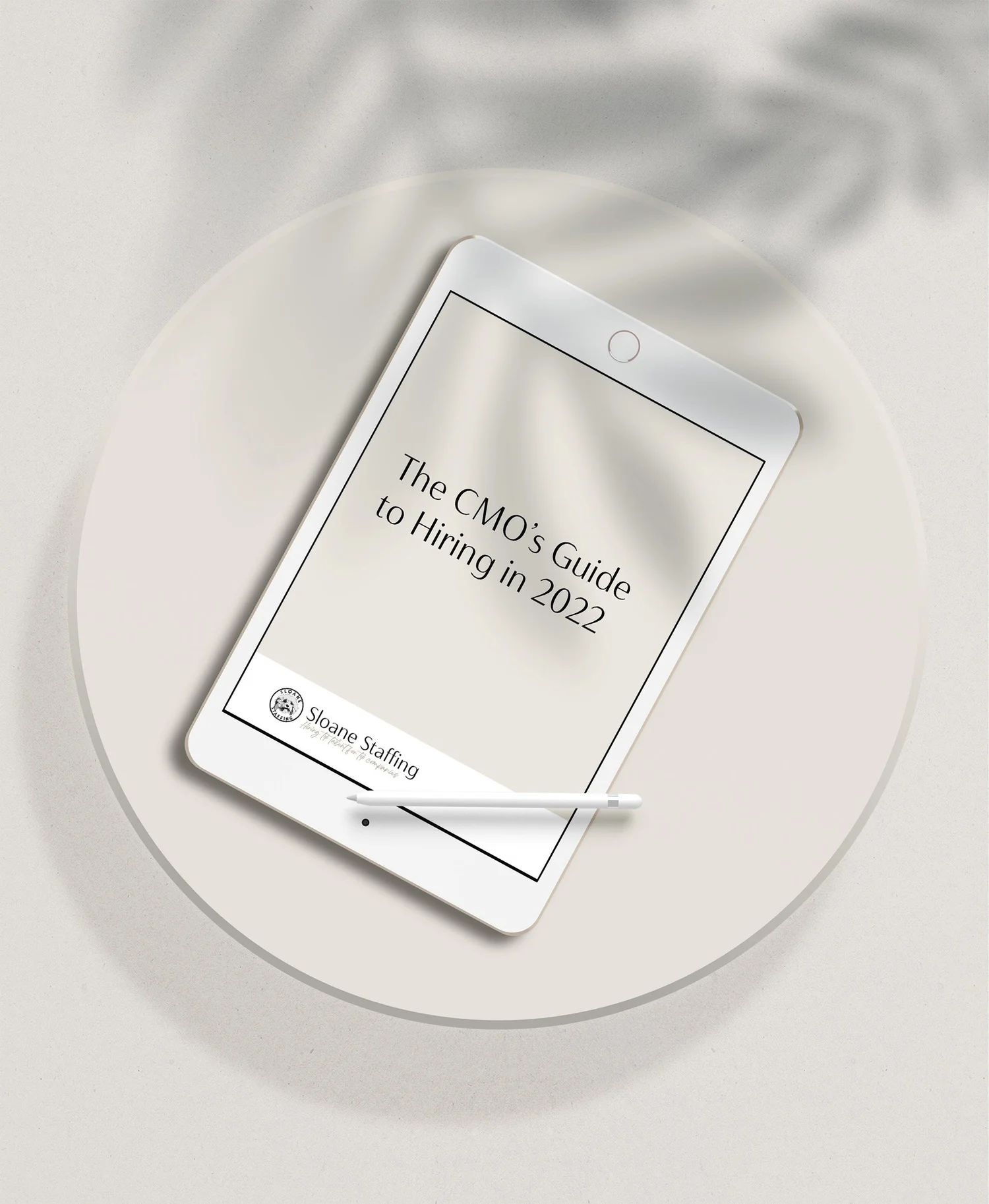 Tablet displaying “The CMO’s Guide to Hiring in 2022” by Sloane Staffing, with a stylus resting on the screen.